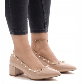 Pink lacquered pumps on the X-70 pillar 1