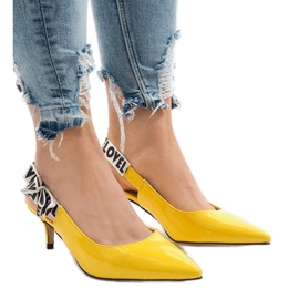 Yellow pumps on a HD-28 heel 1
