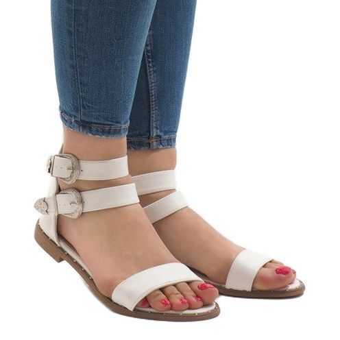 White flat sandals with a 170 buckle 1