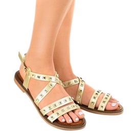 Golden flat sandals decorated with M-520 1