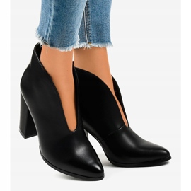 Black slip-on boots with cutouts on the RB38P post 2