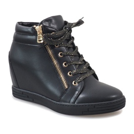 Black sneakers with a gold TL-22 zipper 1