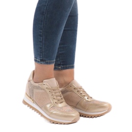 Golden sneakers on the wedge G-125 1