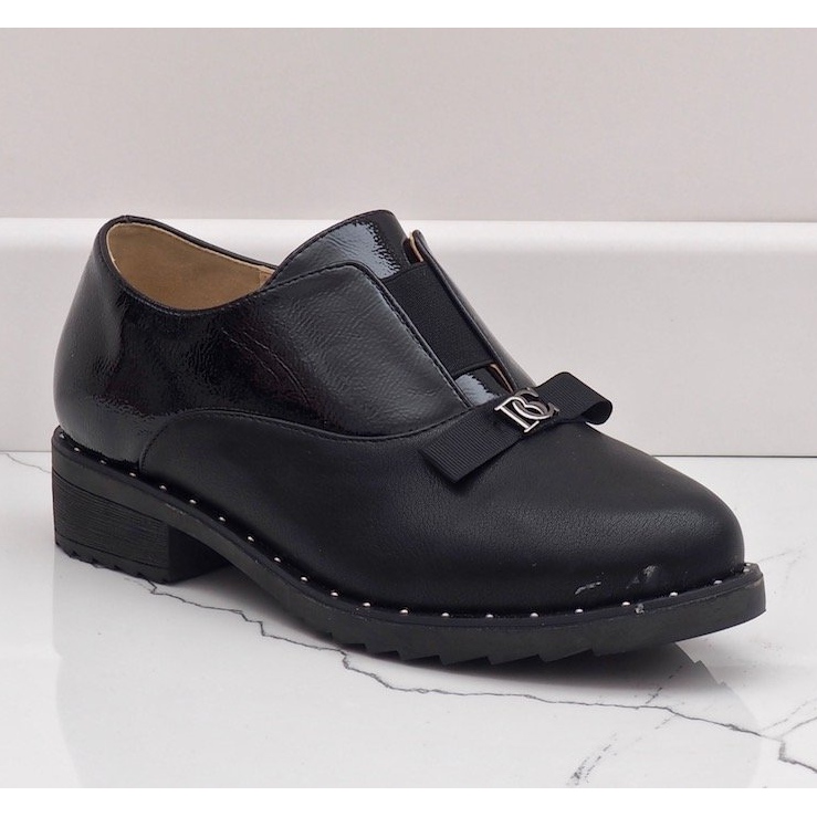 Black slip-on shoes with X528 studs 1