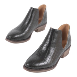 Black slip-on boots with cutouts on the NS132P post 1