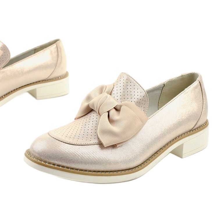 Black slip-on shoes with a RS-WED2 bow golden 1