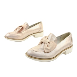 Black slip-on shoes with a RS-WED2 bow golden 2