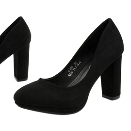Black suede pumps on the Recite post 1