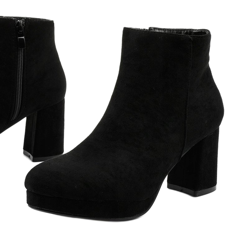 Black suede ankle boots on the Mahoganis post 1