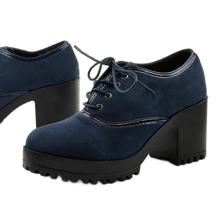 Navy blue ankle boots laced on a Clearfall block 1