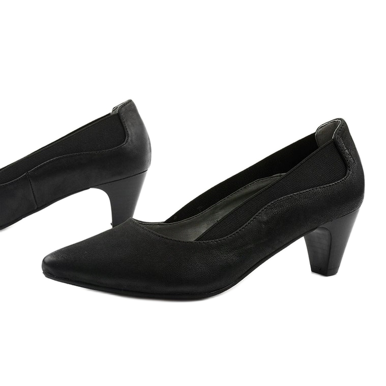 Ladies' black pumps on the Deloney post 1