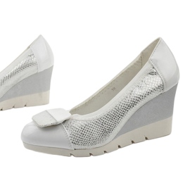 Silver pumps on the Downreaver wedge heel 1