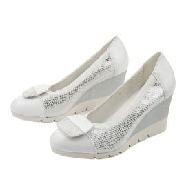 Silver pumps on the Downreaver wedge heel 2