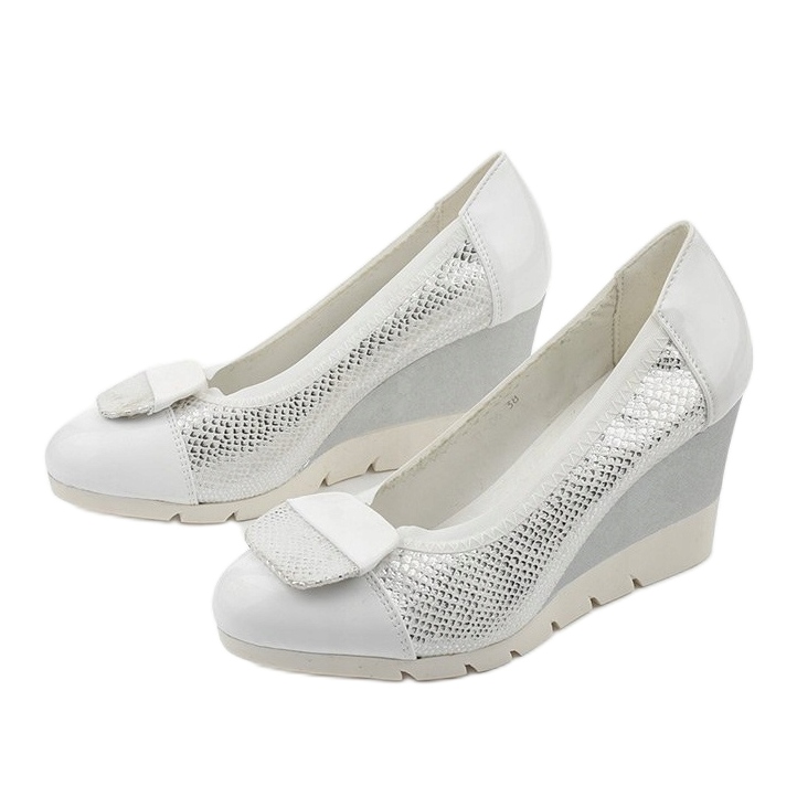 Silver pumps on the Downreaver wedge heel 2