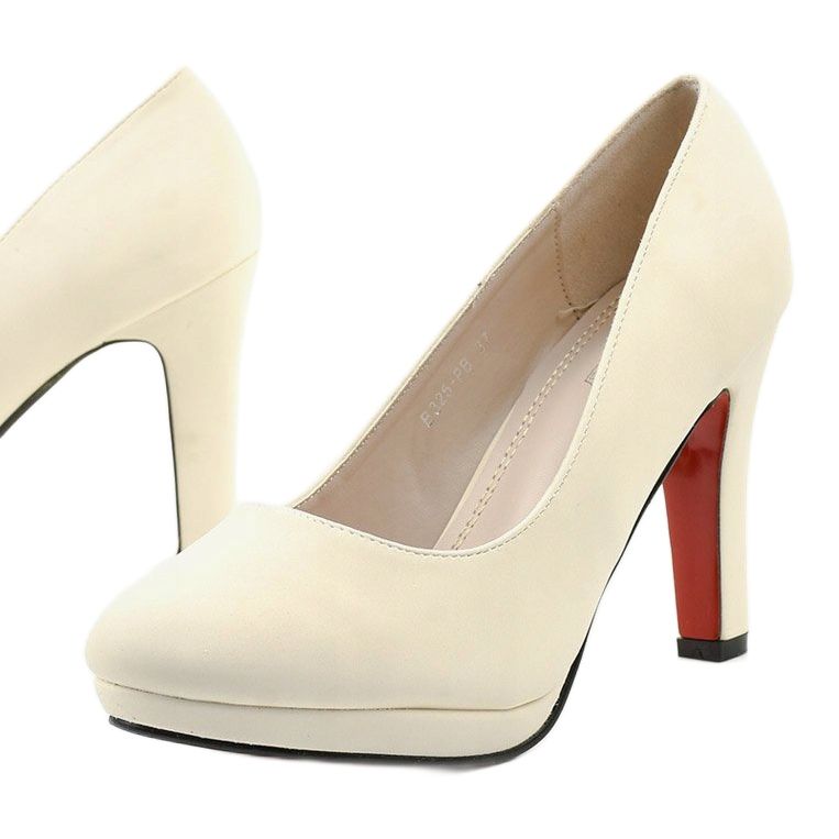 White pumps on a thick Doombrace heel 1