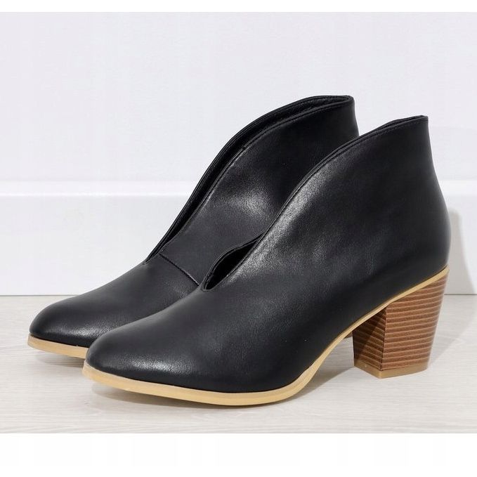 Black slip-on boots with cutouts on the NS128P post 1
