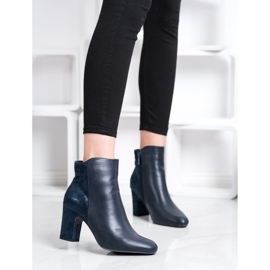 Kylie Navy blue boots on a pillar 1