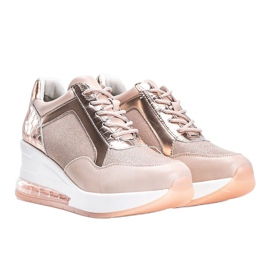 Pink gold sneakers on the Jimena wedge 1