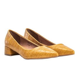 Mustard-colored pumps on a block in the Hallie snake skin pattern yellow 1