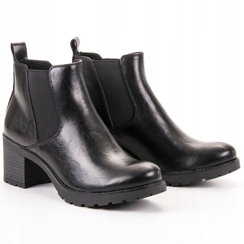 W. Potocki Black Chelsea Boots On A Bar 1