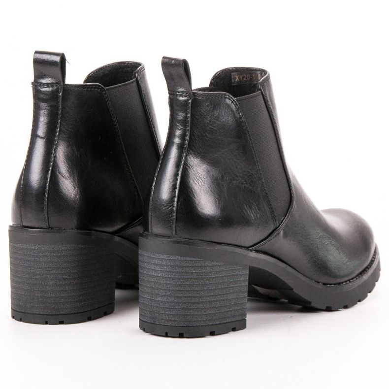 W. Potocki Black Chelsea Boots On A Bar 2