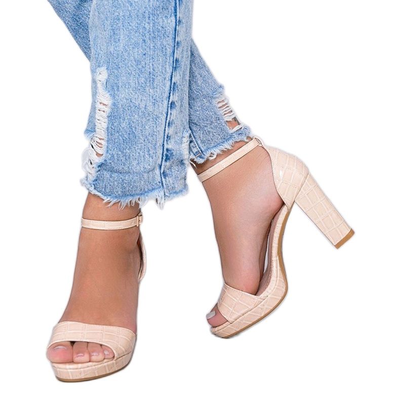 Beige sandals on a post with a Black Rose leather pattern 1