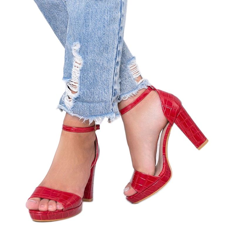 Red sandals on a post with a Black Rose leather pattern 1