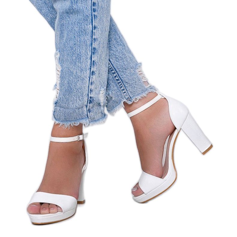 White sandals on a post with a Black Rose leather pattern 1