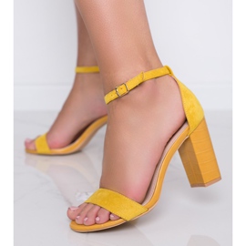 Yellow pumps on a post with Dolores snakeskin motif 1