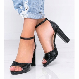 Black sandals on a post with Millo snakeskin pattern 2