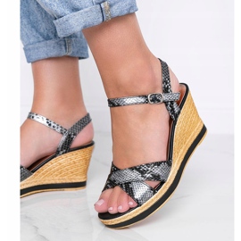 Black metallic wedge sandals in Peekaboo snake skin pattern 1