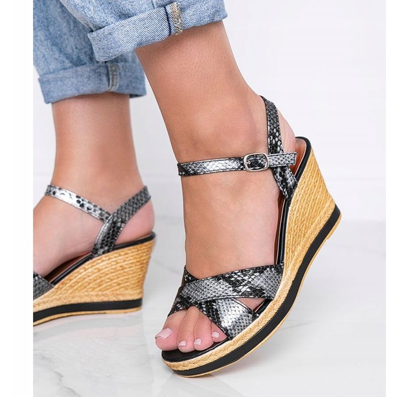 Black metallic wedge sandals in Peekaboo snake skin pattern 1
