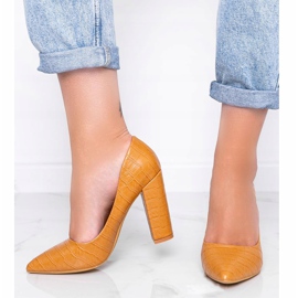 Brown pumps on a post with This Way snakeskin motif 1