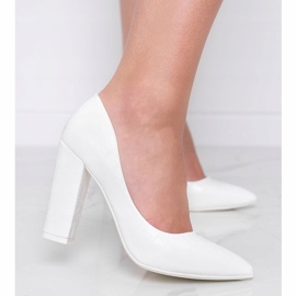 White pumps on a post with a snake skin pattern This Way 1