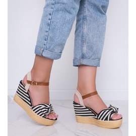 Black and white wedge sandals with a Holiday Vibes bow 2