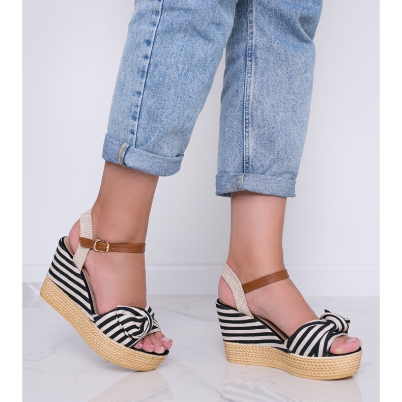 Black and white wedge sandals with a Holiday Vibes bow 2