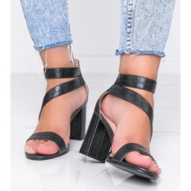 Black sandals on a Silver Dust post 1
