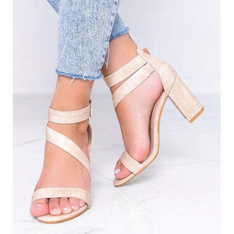 Beige sandals on a Silver Dust post 1