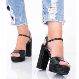 Black lacquered sandals on the Joni post 1