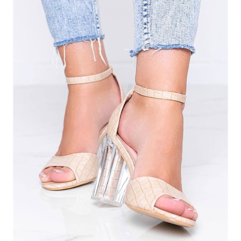 Beige pumps on a post with a transparent No Fear heel 1