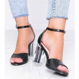 Black pumps on a post with a transparent No Fear heel 1