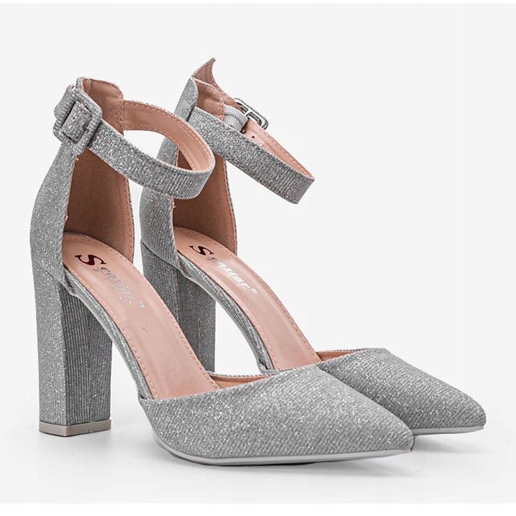 Shiny silver pumps on Mila's post 1