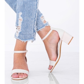 Beige sandals on a low Sever post 1