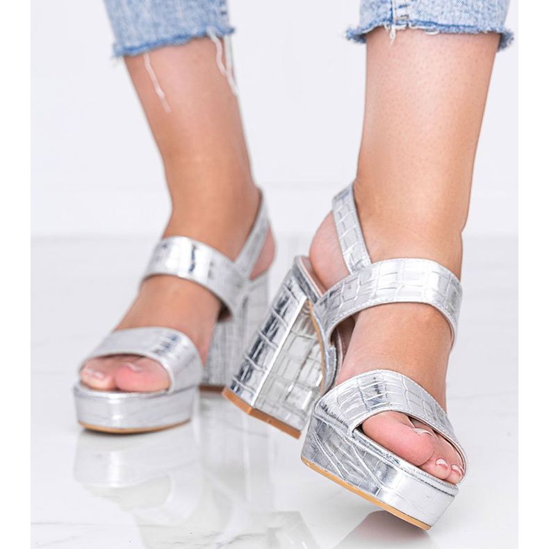 Silver metallic sandals on a post in the Liv animal theme 1