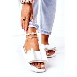 Rubber Flip Flops With A White April Bow 1