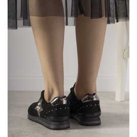 Black sports sneakers decorated with Ruler studs 1