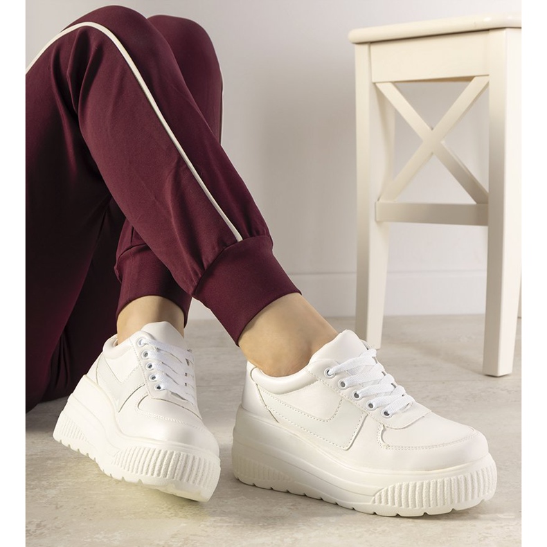 White sports sneakers with a high Challenge sole 1
