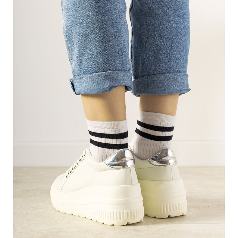 White sports sneakers with a high Under sole 2