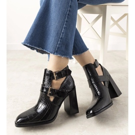 Black boots on a post in the Maybelle crocodile skin pattern 2