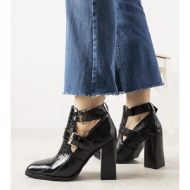 Black boots on a post in the Maybelle crocodile skin pattern 1